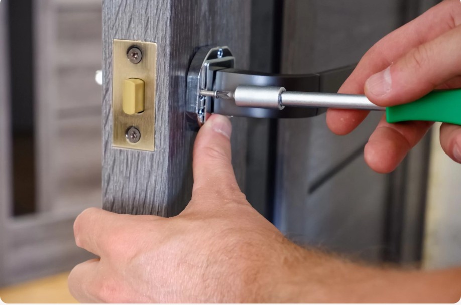 Close-up of a technician repairing a door lock