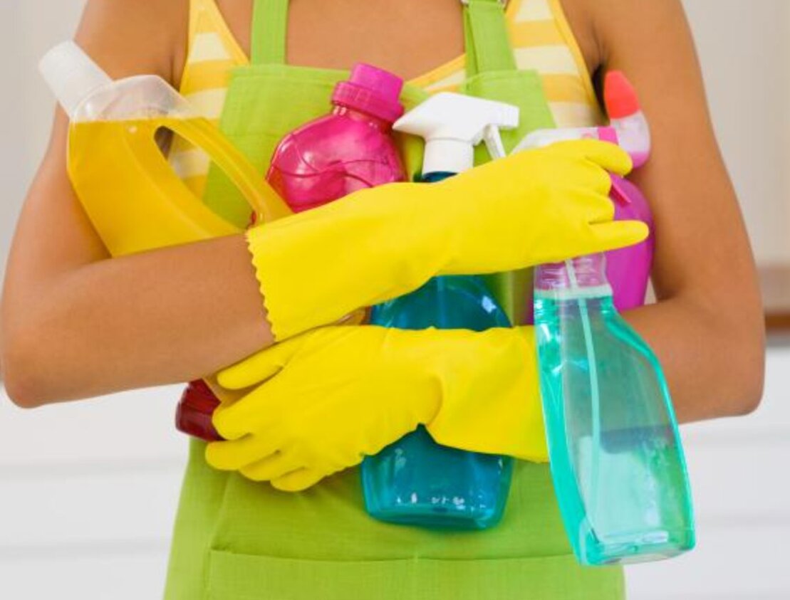 Cleaner preparing a holiday apartment bedroom