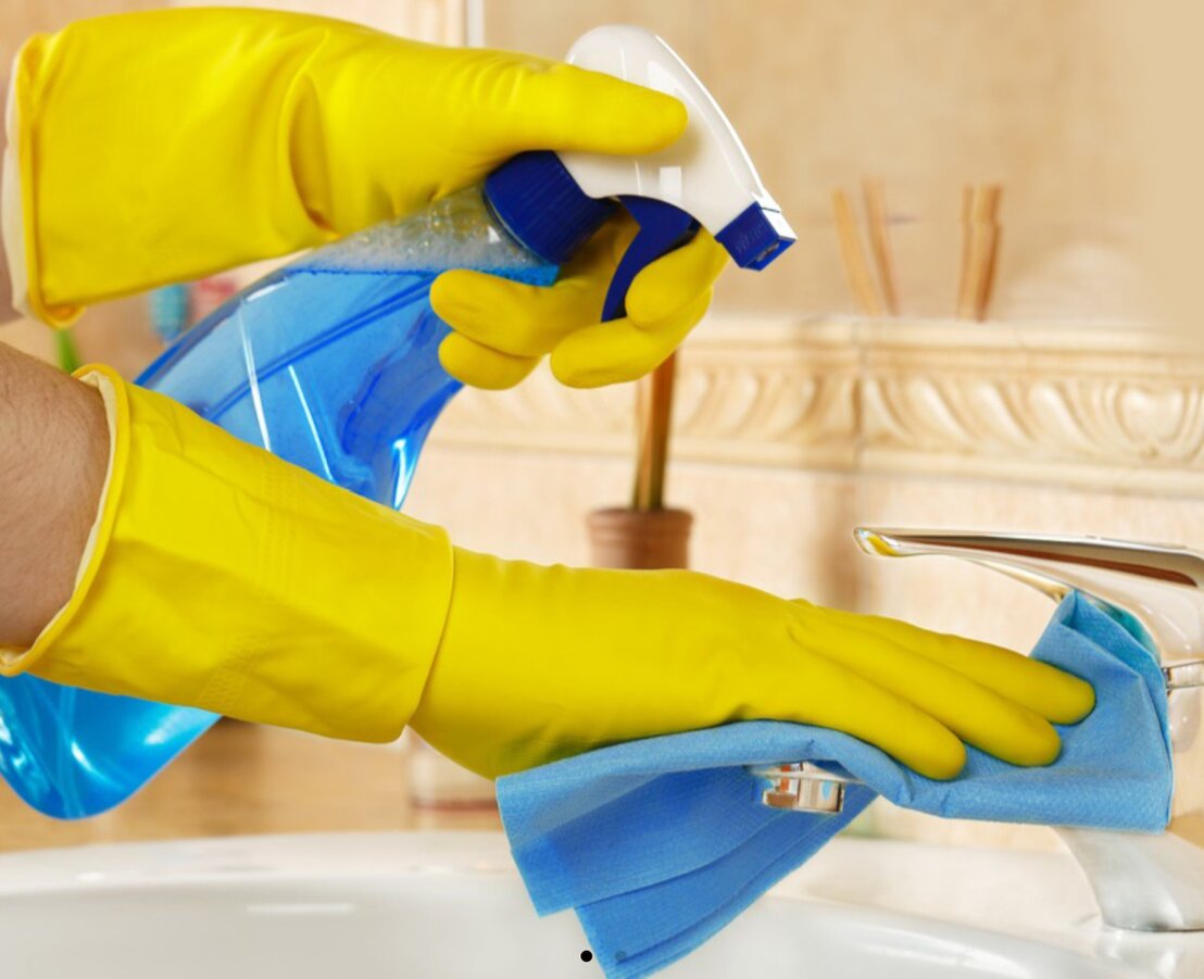 Cleaner preparing a holiday apartment in Akbuk